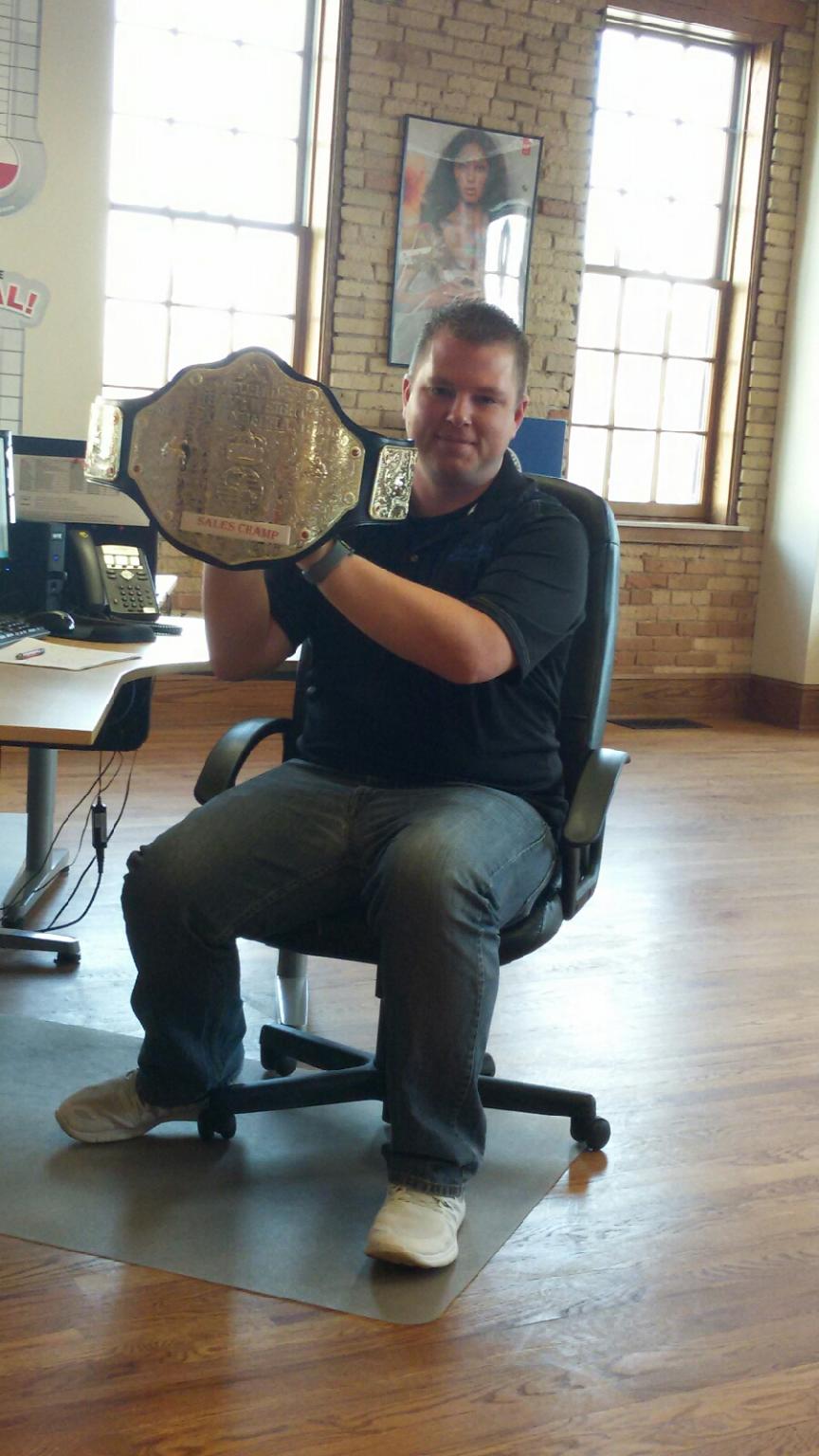 Image of ScholarBuys employee Michael Heap with the sales champ title