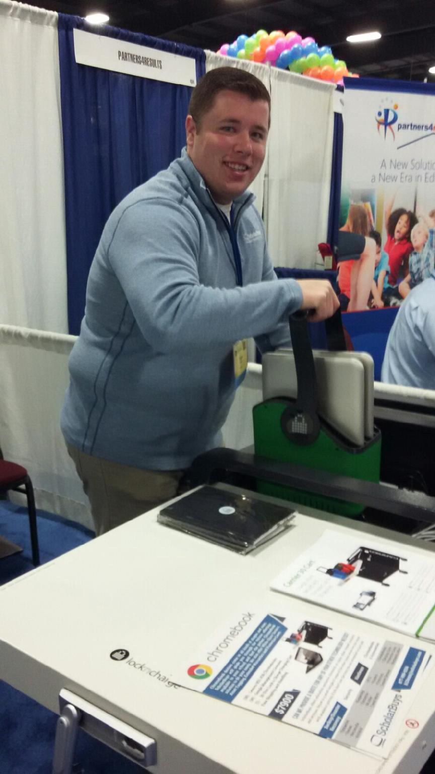 Image of ScholarBuys employee with LocknCharge Carrier 30 Charging Cart