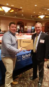Image of ScholarBuys employee with Lenovo Chromebook raffle winner