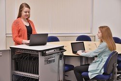Image of students using Chromebooks with a Charging Cart